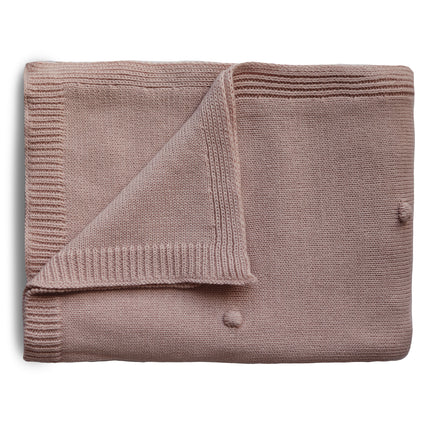 Coperta per culla Mushie a pois strutturati Blush